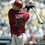 Arizona Diamondbacks' Adam Dunn follows through on a double against the Los Angeles Dodgers in the first inning of a baseball game Sunday, Sept. 7, 2008, in Los Angeles. (AP Photo/Ric Francis)