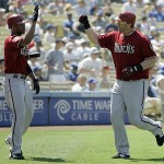 Arizona Diamondbacks' Adam Dunn, right, is congratulated by Chris Young after hitting a home run against the Los Angeles Dodgers in the third inning of a baseball game on Sunday, Sept. 7, 2008, in Los Angeles. (AP Photo/Ric Francis)