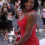 U.S. Open women's singles tennis champion Serena Williams poses with her trophy in New York's Times Square on Monday Sept. 8, 2008, in New York. (AP Photo/Brian McDermott)