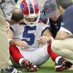 Buffalo Bills quarterback Trent Edwards (5) is assisted by trainers after suffering a concussion against the Arizona Cardinals during the first quarter of an NFL football game Sunday, Oct. 5, 2008, in Glendale, Ariz. (AP Photo/Ross D. Franklin)