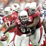 Arizona Cardinals' Antonio Smith (94) celebrates with teammate Darnell Dockett (90) after Smith recovered a fumble against the Buffalo Bills during the first quarter of an NFL football game Sunday, Oct. 5, 2008, in Glendale, Ariz. (AP Photo/Matt York)