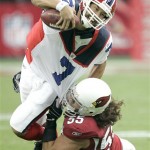 Buffalo Bills quarterback J.P. Losman (7) is tackled by Arizona Cardinals' Travis LaBoy during the first quarter of an NFL football game Sunday, Oct. 5, 2008, in Glendale, Ariz. (AP Photo/Jason Babyak)