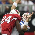 Buffalo Bills quarterback Trent Edwards, right, is injured as he is hit by Arizona Cardinals' Adrian Wilson (24) in the first quarter of a football game Sunday, Oct. 5, 2008, in Glendale, Ariz. (AP Photo/Ross D. Franklin)