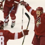 Phoenix Coyotes' Peter Mueller, left, celebrates his goal with teammate Olli Jokinen, right, of Finland, in the first period of an NHL hockey game against the Columbus Blue Jackets Saturday, Oct. 11, 2008, in Glendale, Ariz. (AP Photo/Ross D. Franklin)