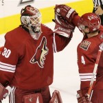 Phoenix Coyotes' Ilya Bryzgalov (30), of Russia, is congratulated by teammate Zbynek Michalek, of the Czech Republic, after the Coyotes win over the Columbus Blue Jackets in an NHL hockey game Saturday, Oct. 11, 2008, in Glendale, Ariz. The Coyotes defeated the Blue Jackets 3-1. (AP Photo/Ross D. Franklin)