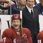 Phoenix Coyotes' Todd Fedoruk, bottom, laughs after head coach Wayne Gretzky, top, talks to him in the second period of an NHL hockey game against the Columbus Blue Jackets Saturday, Oct. 11, 2008, in Glendale, Ariz. The Coyotes defeated the Blue Jackets 3-1. (AP Photo/Ross D. Franklin)