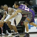 Phoenix Suns guard Steve Nash (13) reaches for the ball controlled by Atlanta Hawks guard Acie Law during the first half of an NBA preseason basketball game, Wednesday Oct. 15, 2008, in Atlanta. (AP Photo/John Amis)