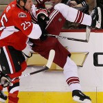 Ottawa Senators' Chris Neil (25) hits Phoenix Coyotes' Steve Reinprecht during third-period NHL hockey action at the Scotiabank Place in Ottawa, Ontario, on Friday, Oct. 17, 2008. The Senators defeated the Coyotes 6-3. (AP Photo/The Canadian Press,Sean Kilpatrick)