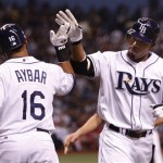 Tampa Bay Rays' Carl Crawford, right, is congratulated by his teammate Willy Aybar after hitting a solo home run against Philadelphia Phillies' Cole Hamels in the fourth inning of Game 1 of the baseball World Series in St. Petersburg, Fla., Wednesday, Oct. 22, 2008. (AP Photo/Chris O'Meara)