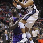 New Jersey Nets' Vince Carter goes up with a shot as he is guarded by Phoenix Suns' Shaquille O'Neal during the second quarter of an NBA basketball game Tuesday night, Nov. 4, 2008, in East Rutherford, N.J. (AP Photo/Bill Kostroun)
