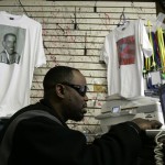 Kareem Hunter, owner of Oladejon Clothing print shop in Newark, N.J., works at making graphics of President-elect Barack Obama for T-shirts for sale at his shop Wednesday, Nov. 5, 2008. Obama T-shirts were selling briskly the day after he won the U.S. presidential election. (AP Photo/Mike Derer)