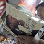 A Chinese man reads a book about U.S. President-elect Barack Obama at a bookstore in Chengdu, southwest China's Sichuan province, Wednesday, Nov. 5, 2008. (AP Photo/Color China Photo)