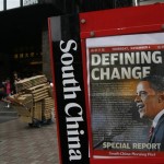 A newspaper headline featuring U.S. President-elect Barack Obama is seen at a Hong Kong downtown street Thursday, Nov. 6, 2008. (AP Photo/Vincent Yu)