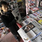 A newspaper vendor sorts dailies featuring U.S. President-elect Barack Obama on their front pages at as news stand in Beijing , China, Thursday, Nov. 6, 2008. The U.S. election campaign has received extensive coverage in the state-run media in China, with considerable attention focused on Obama attempting to become the first black American to be elected to the White House. (AP Photo/Elizabeth Dalziel)
