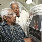 Lelia LaRue, right, shows her father, George Francis, 112, a copy of the morning newspaper with President-elect Barack Obama on the front page, at the Sacramento, Calif. nursing home where Francis lives, Wednesday, Nov. 5, 2008. Francis, the oldest living male in the U.S. according to records kept by the Gerontology Research Group, is believed to be the oldest man to vote for Obama in Tuesday's election. (AP Photo/Rich Pedroncelli)