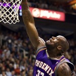 Phoenix Suns center Shaquille O'Neal (32) puts the ball through the hoop against the Utah Jazz during the second quarter of the NBA basketball game Monday, Nov. 17, 2008, in Salt Lake City. (AP Photo/Douglas C. Pizac)