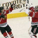 Chicago Blackhawks' Nikolai Khabibulin, right, celebrates with teammate Duncan Keith after a shootout win over the Phoenix Coyotes in an NHL hockey game Tuesday, Nov. 18, 2008 in Glendale, Ariz. The Blackhawks defeated the Coyotes 3-2 in a shootout. (AP Photo/Ross D. Franklin)