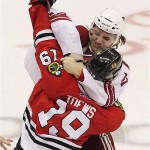 Chicago Blackhawks' Jonathan Toews (19) gets in a fight with Phoenix Coyotes' Martin Hanzal, of the Czech Republic, in the third period of an NHL hockey game Tuesday, Nov. 18, 2008 in Glendale, Ariz. The Blackhawks defeated the Coyotes 3-2 in a shootout. (AP Photo/Ross D. Franklin)