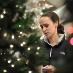 Jennifer Pope looks at Christmas trees at Sears in the OakBrook Center Shopping Mall in OakBrook Illinois, Friday, Nov. 28, 2008. (AP Photo/Paul Beaty)