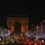 Christmas decorations light up the Champs Elysees avenue in Paris, Monday, Dec. 1, 2008, as the Arc de Triomphe is seen in the background. The decorations are traditionally put up late November each year for Christmas. (AP Photo/Muhammed Muheisen)
