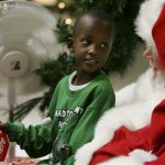 Five year-old Raymond Jemison of Camden, S.C. talks to Santa about what he would like for Christmas as they visit Thursday Nov. 20, 2008, at Columbia Place Mall in Columbia, S.C. (AP Photo/Mary Ann Chastain)
