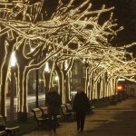 The "Unter den Linden" boulevard is illuminated with fairy lights as Christmas approaches in Berlin on Wednesday, Nov. 26, 2008. The background shows the landmark Brandenburg Gate. (AP Photo/Miguel Villagran)
