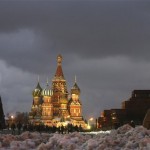 A huge Christmas tree is installed in Red Square,with St. Basil Cathedral, center, and Kremlin's Spassky Tower and Lenin Mausoleum, right, in the background, in Moscow, Wednesday, Nov. 26, 2008. (AP Photo/Mikhail Metzel)