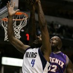 Dallas Mavericks forward Shawne Williams (4) and Phoenix Suns center Shaquille O'Neal, right, compete for a rebound in the first half of an NBA basketball game in Dallas, Thursday, Dec. 4, 2008. (AP Photo/Tony Gutierrez)