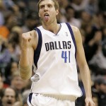 Dallas Mavericks forward Dirk Nowitzki (41), of Germany, celebrates after scoring a three-point basket against the Phoenix Suns in the second half of an NBA basketball game in Dallas, Thursday, Dec. 4, 2008. Nowitzki had a game-high 39 points in the 112-97 win over Phoenix. (AP Photo/Tony Gutierrez)