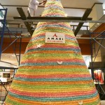 A Thai chef decorates a Christmas tree with sugar candy sticks at a hotel in Bangkok on Friday, Dec. 12, 2008. The festive tree, which is 6 meters tall and weights 779.14 kilograms, is made of about 38,900 pieces of sugar sticks, according to the chef. (AP Photo/Sakchai Lalit)