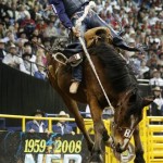 Billy Etbauer, of Edmond, Okla., competes during the eighth go-round of saddle bronc riding at the National Finals Rodeo in Las Vegas, Thursday, Dec. 11, 2008. (AP Photo/Isaac Brekken)