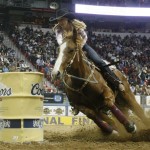 Lindsay Sears, of Canada, rides during the eighth go-round of the barrel racing competition at National Finals Rodeo in Las Vegas, Thursday, Dec. 11, 2008. Sears won the round and clinched the world championship with a time of 13.57 seconds. (AP Photo/Isaac Brekken)