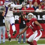 Minnesota Vikings' Cedric Griffin, left, breaks up a pass intended for Arizona Cardinals' Larry Fitzgerald in the second quarter of an NFL football game Sunday, Dec. 14, 2008, in Glendale, Ariz. (AP Photo/Ross D. Franklin)