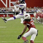 Minnesota Vikings' Cedric Griffin (23) breaks up a pass intended for Arizona Cardinals' Larry Fitzgerald (11) during the fourth quarter of an NFL football game Sunday, Dec. 14, 2008, in Glendale, Ariz. The Vikings won 35-14. (AP Photo/Matt York)