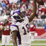 Minnesota Vikings' Sidney Rice (18) celebrates his touchdown catch as Arizona Cardinals' Travis LaBoy (55) looks on in the first quarter of an NFL football game Sunday, Dec. 14, 2008 in Glendale, Ariz. (AP Photo/Ross D. Franklin)