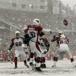 Arizona Cardinals quarterback Kurt Warner is hit by New England Patriots' Jarvis Green on an incomplete pass during the second quarter of an NFL football game in Foxborough, Mass., Sunday, Dec. 21, 2008. (AP Photo/Winslow Townson)