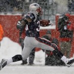 New England Patriots running back Kevin Faulk (33) high steps through a snowfall into the end zone for a touchdown during second-quarter action of their NFL game against the and his wife Arizona Cardinals at the Patriots' football facility in Foxborough, Mass., Sunday afternoon, Dec. 21, 2008. (AP Photo/Stephan Savoia)