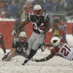 New England Patriots running back Sammy Morris runs past Arizona Cardinals cornerback Antrel Rolle during the second quarter of the Patriots' 44-7 win in an NFL football game at Gillette Stadium in Foxborough, Mass., Sunday, Dec. 21, 2008. (AP Photo/Winslow Townson)