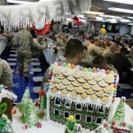 Gingerbread houses decorate a dining area for Christmas aboard the U.S. Navy ship USS Iwo Jima, which is docked in Manama, Bahrain, on Tuesday, Dec. 23, 2008. (AP Photo/Hasan Jamali)
