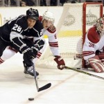 Phoenix Coyotes center Kyle Turris, center, and goalie Ilya Bryzgalov, of Russia, watch Los Angeles Kings center Jarret Stoll prepare to shoot during the second period of an NHL hockey game in Los Angeles, Friday, Dec. 26, 2008. (AP Photo/Chris Carlson)
