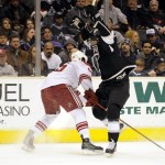Los Angeles Kings right wing Wayne Simmonds, right, jumps out of the way of Phoenix Coyotes defenseman Ed Jovanovski during the second period of their NHL hockey game in Los Angeles, Friday, Dec. 26, 2008. (AP Photo/Chris Carlson)