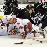 Phoenix Coyotes goalie Ilya Bryzgalov, right, of Russia, and defenseman Ed Jovanovski prepare to block a shot by Los Angeles Kings center Jarret Stoll, right, during the second period of their NHL hockey game in Los Angeles, Friday, Dec. 26, 2008. (AP Photo/Chris Carlson)