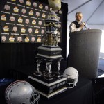 The Fiesta Bowl trophy is displayed as Ohio State coach Jim Tressel speaks at the podium during a news conference at Sky Harbor International Airport in Phoenix, Monday, Dec. 29, 2008. Ohio State will play Texas in the Fiesta Bowl on Jan. 5. (AP Photo/Paul Connors)