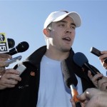 Texas quarterback Colt McCoy answers reporters' questions after arriving for the Fiesta Bowl Monday, Dec. 29, 2008, at Sky Harbor International Airport in Phoenix. Texas will play Ohio State in the Fiesta Bowl on Jan. 5. (AP Photo/Paul Connors)