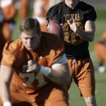Texas quarterback Colt McCoy, top, takes a shotgun snap from center Chris Hall, bottom, during football practice Tuesday, Dec. 30, 2008, in Scottsdale, Ariz. Texas will play Ohio State in the Fiesta Bowl on Monday, Jan. 5, 2009. (AP Photo/Paul Connors)
