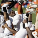 Texas linebacker Rashad Bobino stretches out prior to football practice Wednesday, Dec. 31, 2008, in Scottsdale, Ariz. Texas will play Ohio State in the Fiesta Bowl NCAA college football game on Monday, Jan. 5, 2009. (AP Photo/Paul Connors)
