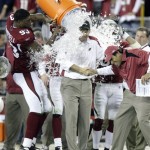 Arizona Cardinals head coach Ken Whisenhunt gets doused by his players during the fourth quarter of an NFL wild-card playoff football game against the Atlanta Falcons Saturday, Jan. 3, 2009 in Glendale, Ariz. The Cardinals won 30-24. (AP Photo/Paul Connors)