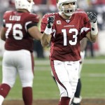 Arizona Cardinals quarterback Kurt Warner (13) looks back to his bench after converting a first down during the fourth quarter of an NFL wild-card playoff football game against the Atlanta Falcons, Saturday, Jan. 3, 2009 in Glendale, Ariz. The Cardinals were able to run out the clock as a result of the first down. The Cardinals won 30-24. (AP Photo/Matt York)