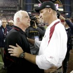 Arizona Cardinals head coach Ken Whisenhunt, right, greets Atlanta Falcons head coach Mike Smith after the Cardinals defeated the Falcons 30-24 in an NFL wild-card playoff football game Saturday, Jan. 3, 2009 in Glendale, Ariz. (AP Photo/Matt York)
