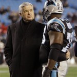 Carolina Panthers owner Jerry Richardson, left, talks with player Jeremy Bridges (73) before an NFL divisional playoff football game against the Arizona Cardinals in Charlotte, N.C., Saturday, Jan. 10, 2009. (AP Photo/Chuck Burton)
